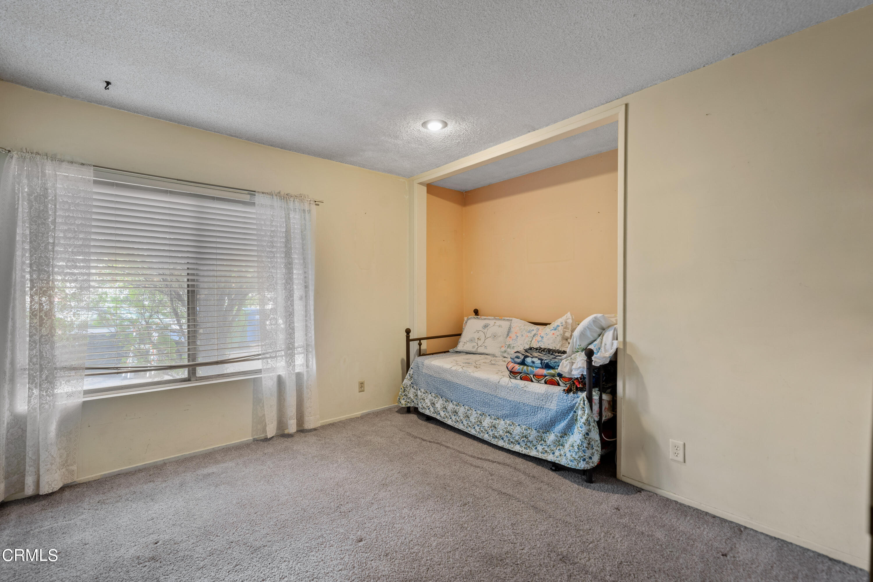 7024 Charrick Place Tujunga, CA 91042 - Photo 18 of 45 a living room with furniture and a large window