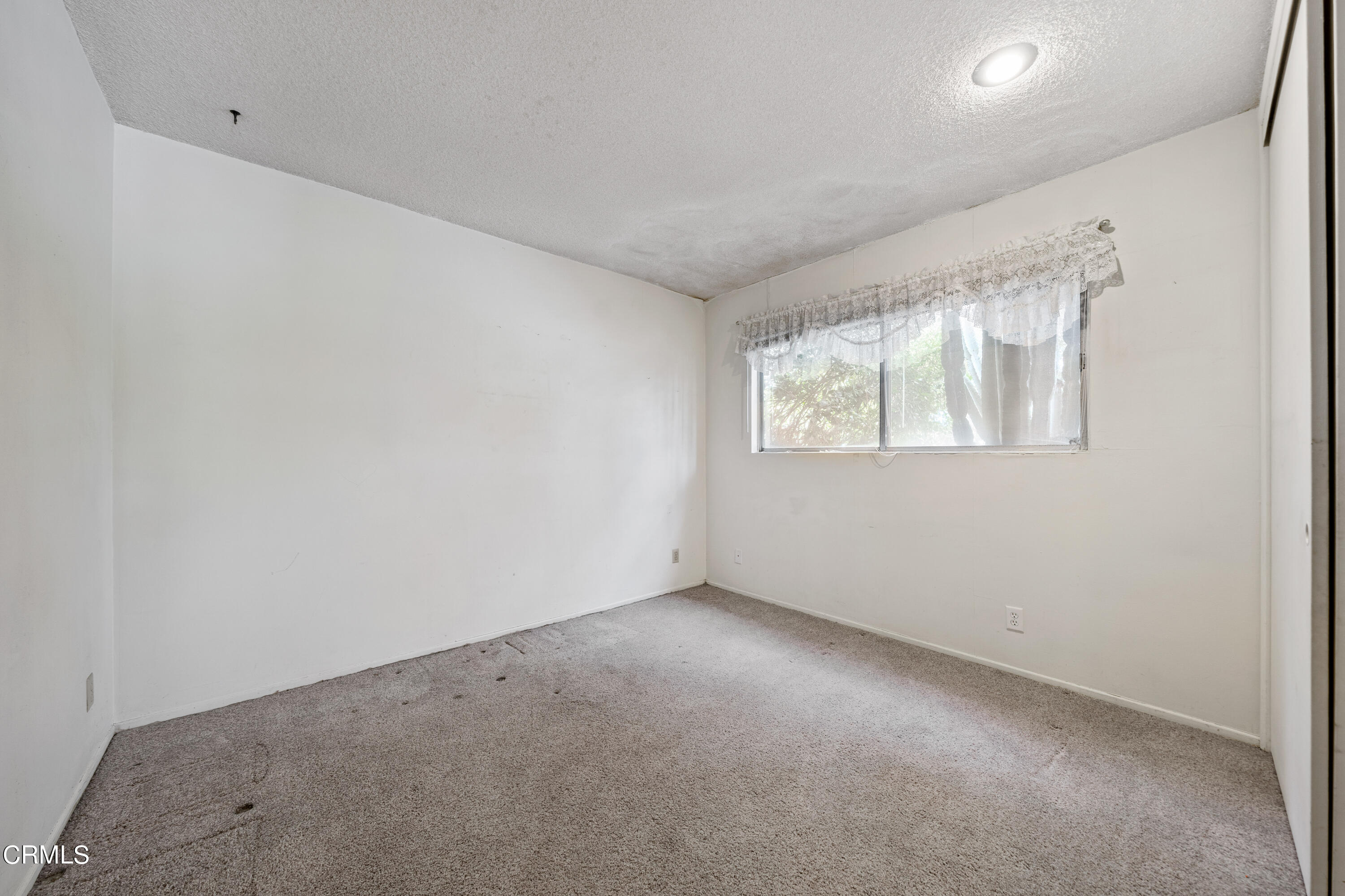 7024 Charrick Place Tujunga, CA 91042 - Photo 23 of 45 an empty room with windows