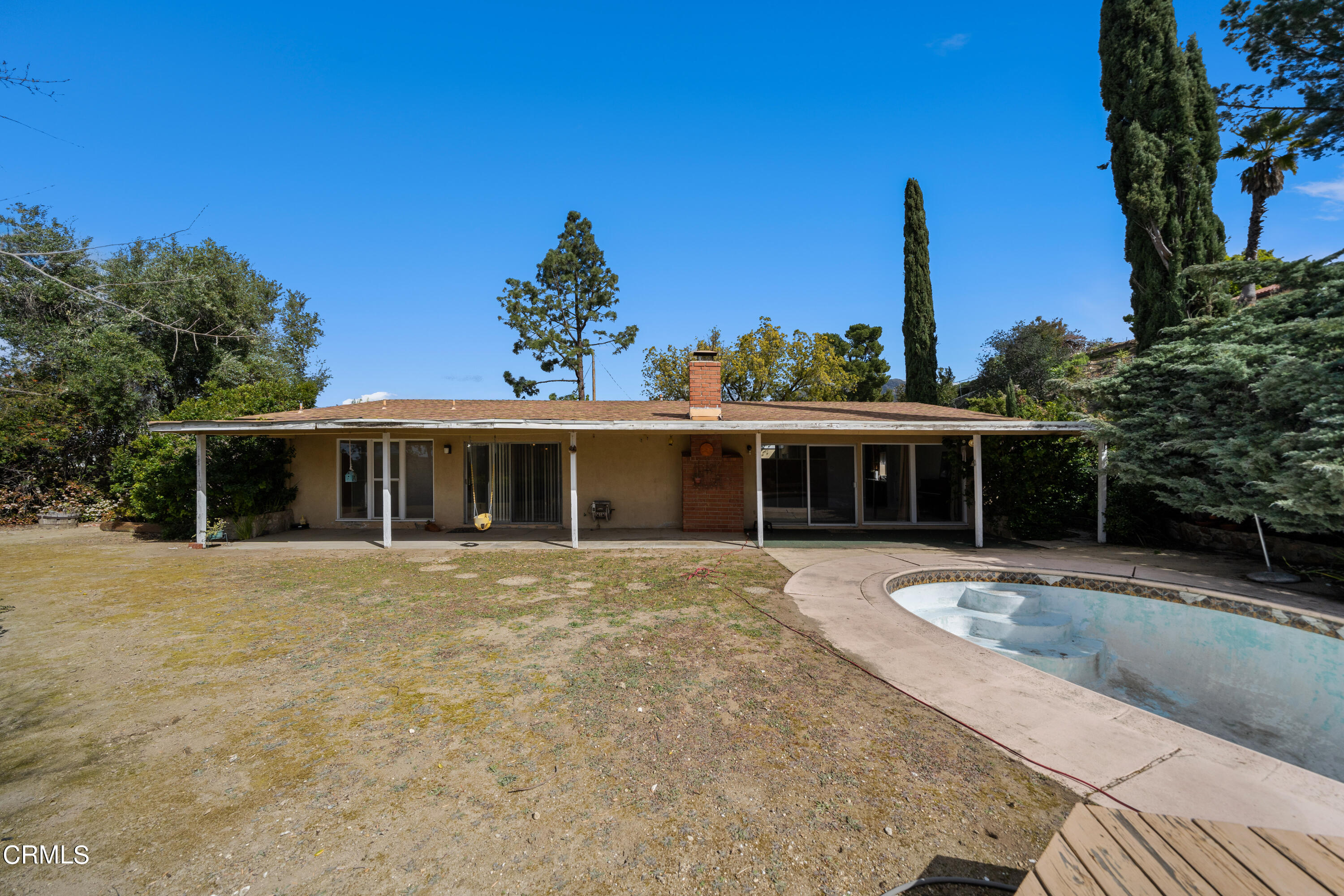 7024 Charrick Place Tujunga, CA 91042 - Photo 33 of 45 a front view of a house with a garden