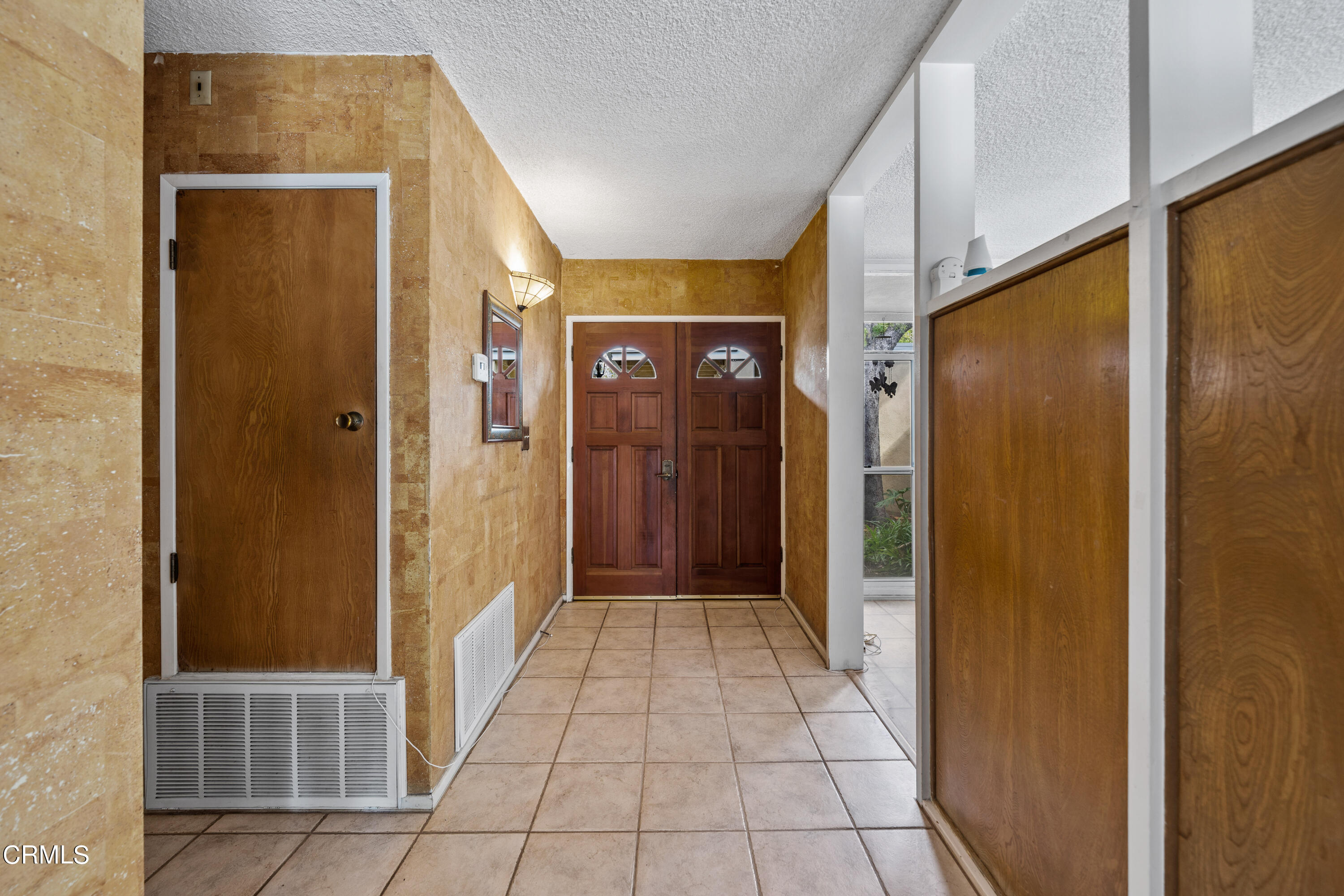 7024 Charrick Place Tujunga, CA 91042 - Photo 6 of 45 a view of a hallway with wooden shelves