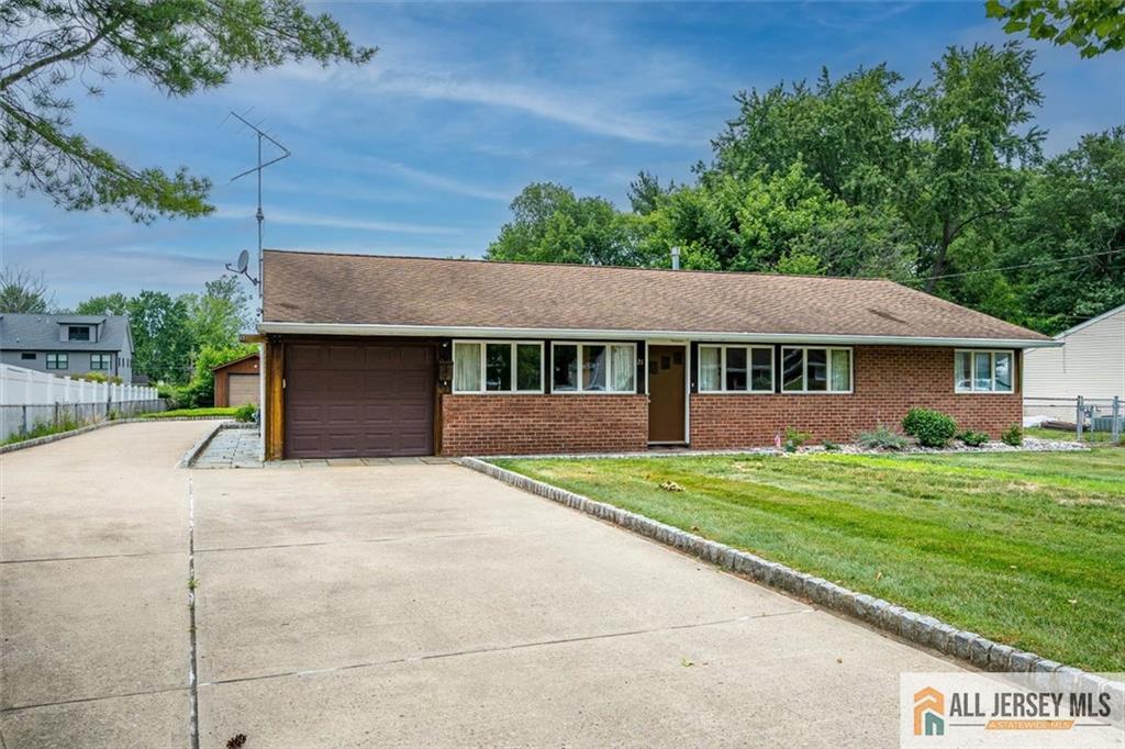 21 Tyndall Road Kendall Park, NJ 08824 - Photo 2 of 33 a front view of a house with a yard