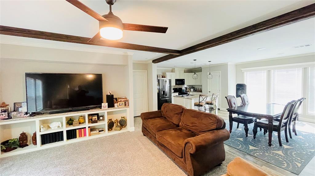 8394 Lake Road Mansfield, TX 76063 - Photo 9 of 22 a living room with furniture and a flat screen tv