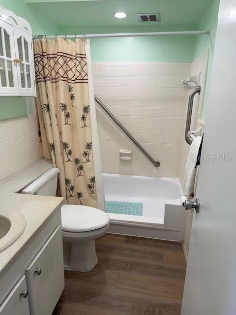 11251 80th Avenue, Unit 309 Seminole, FL 33772 - Photo 12 of 15 a bathroom with a sink toilet and shower