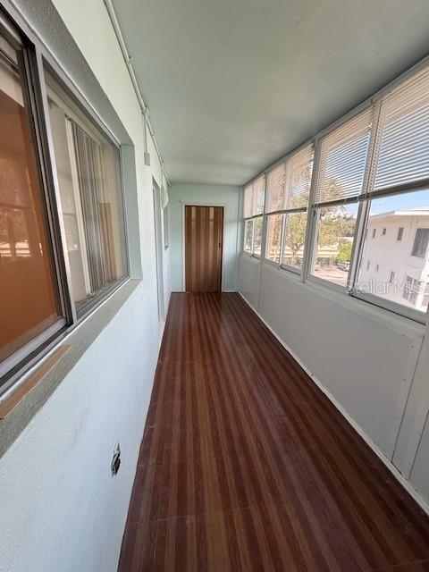 11251 80th Avenue, Unit 309 Seminole, FL 33772 - Photo 14 of 15 a view of an empty room with wooden floor and a window