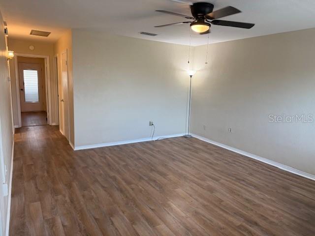 11251 80th Avenue, Unit 309 Seminole, FL 33772 - Photo 2 of 15 a view of empty room with wooden floor
