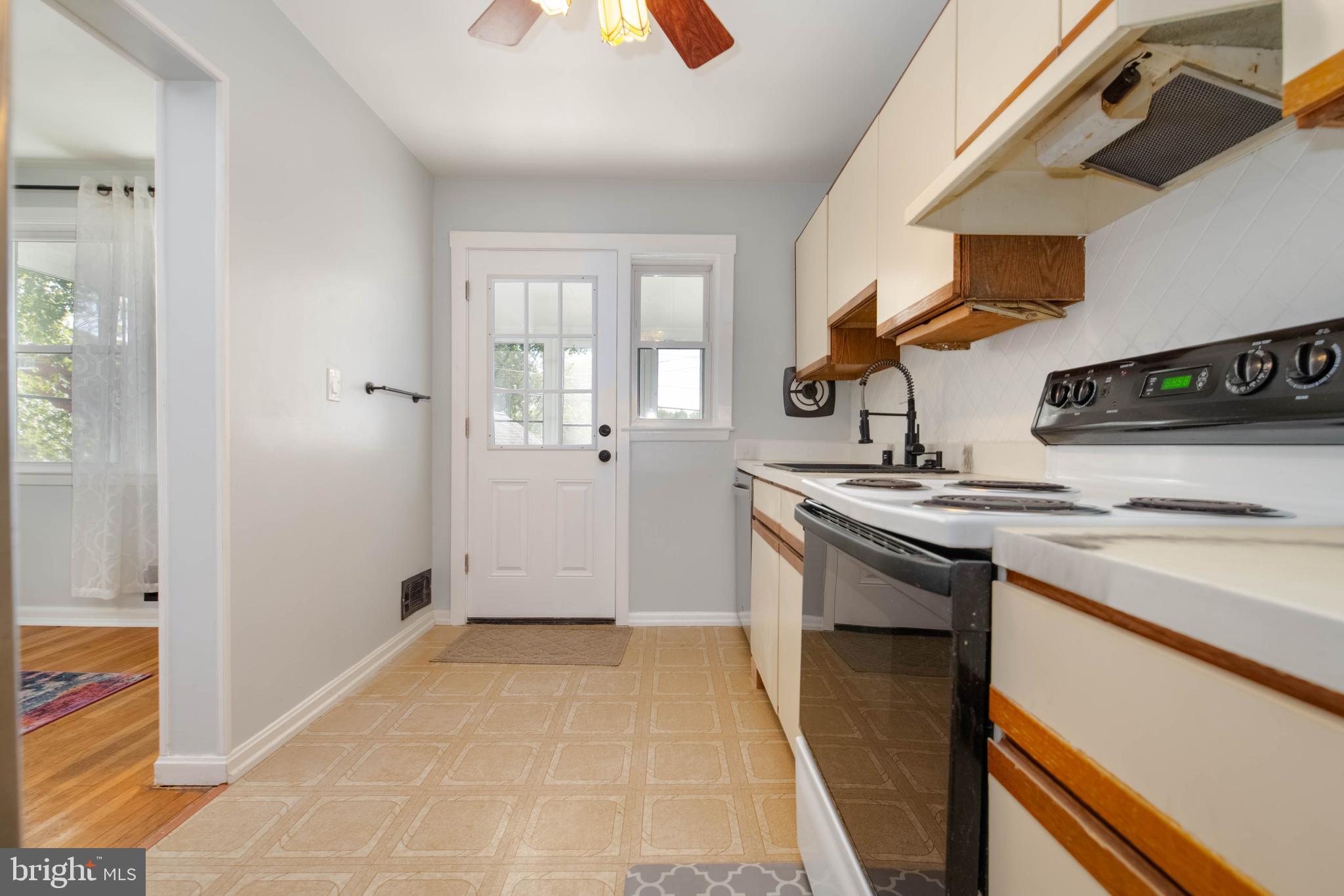 8528 Kings Ridge Road Baltimore, MD 21234 - Photo 15 of 45 a kitchen with a sink and a stove