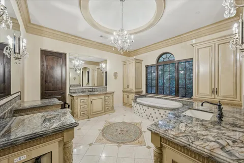 a large kitchen with granite countertop a stove and a sink