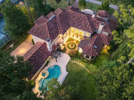 an aerial view of swimming pool patio and outdoor seating