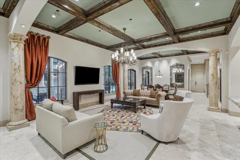 a living room with fireplace furniture and a flat screen tv