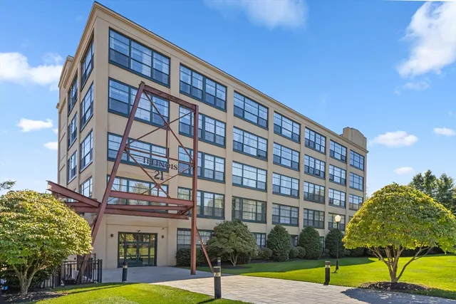 a view of a building with a yard