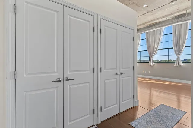 a view of a closet area with en suite bathroom