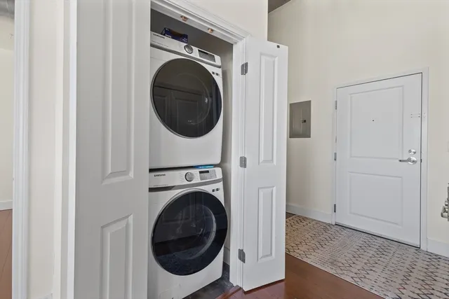 a view of a hallway with washer and dryer