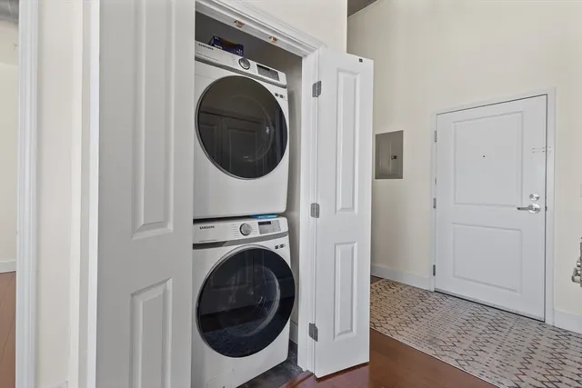 a view of a hallway with washer and dryer