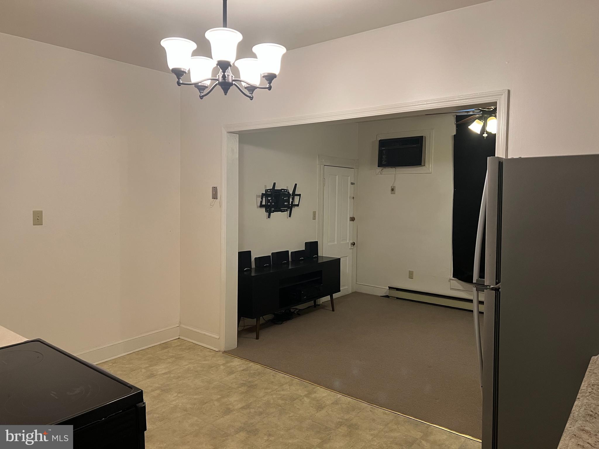 110 South Charles Street, Unit 8 Charles Town, WV 25414 - Photo 10 of 14 a view of a livingroom with a chandelier