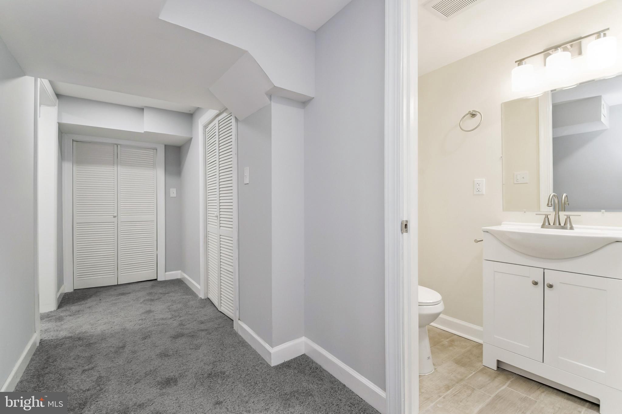 6804 Carol Road Baltimore, MD 21207 - Photo 21 of 25 a view of a bathroom from the hallway