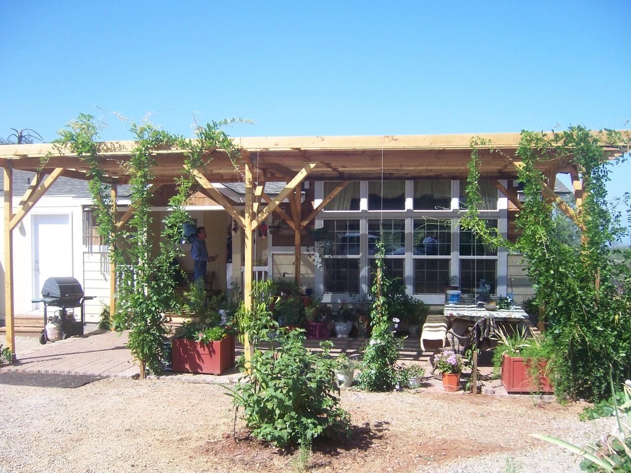 7650 Fisher Road Shingletown, CA 96088 - Photo 1 of 8 a front view of a house with a garden