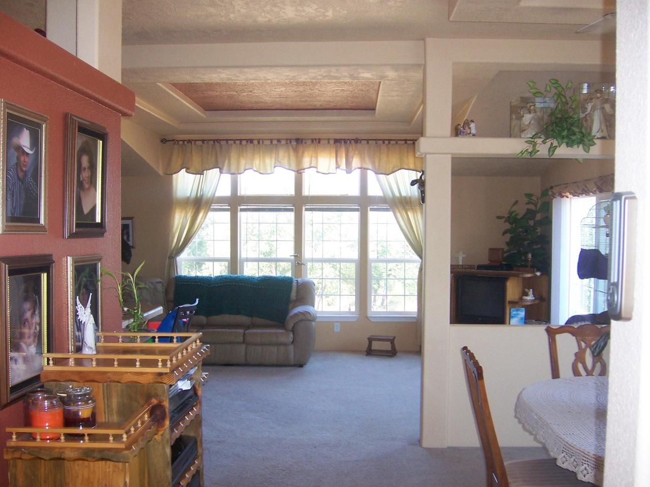 7650 Fisher Road Shingletown, CA 96088 - Photo 2 of 8 a living room with furniture and a flat screen tv