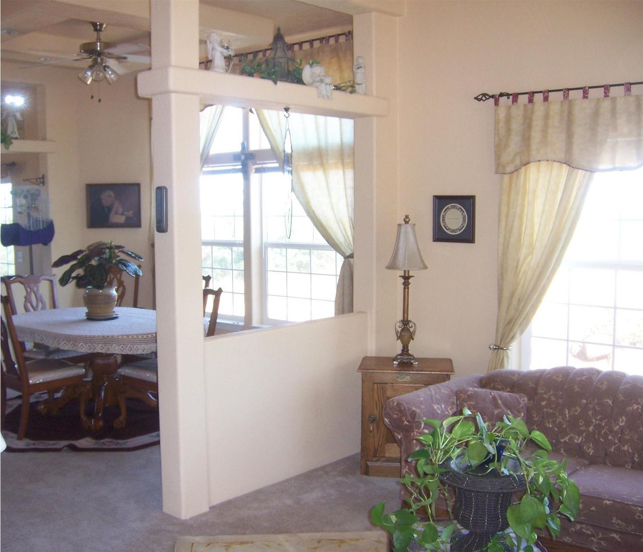 7650 Fisher Road Shingletown, CA 96088 - Photo 3 of 8 a dining room with a window and furniture