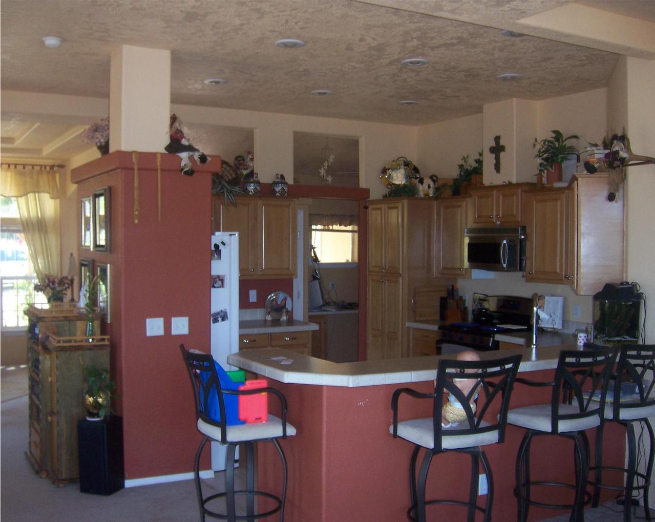 7650 Fisher Road Shingletown, CA 96088 - Photo 5 of 8 a living room with furniture kitchen view and a chandelier