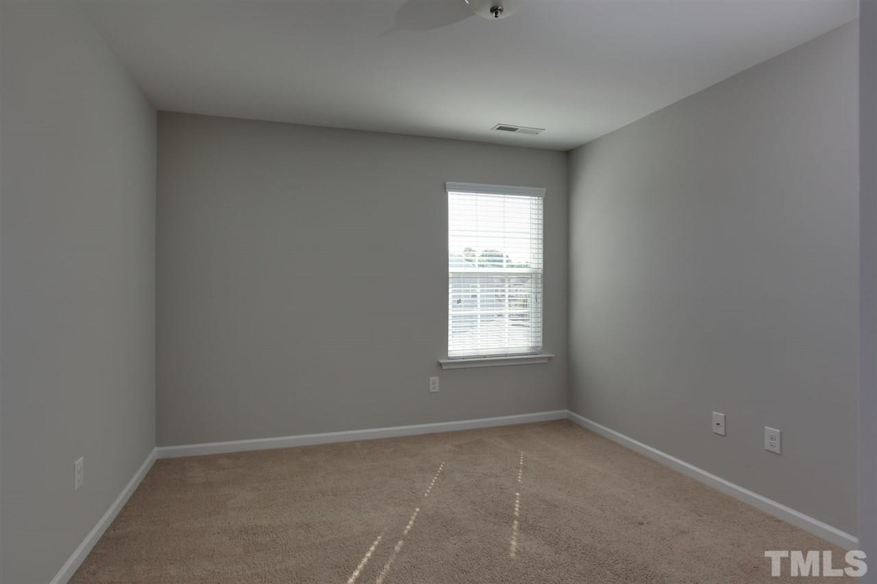 1025 Ileagnes Road Raleigh, NC 27603 - Photo 14 of 25 an empty room with a window