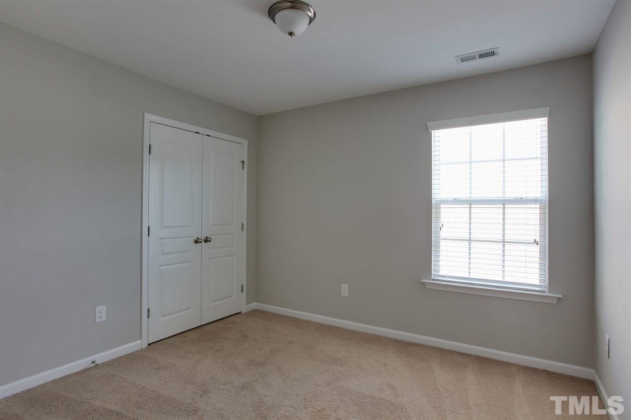 1025 Ileagnes Road Raleigh, NC 27603 - Photo 15 of 25 an empty room with windows