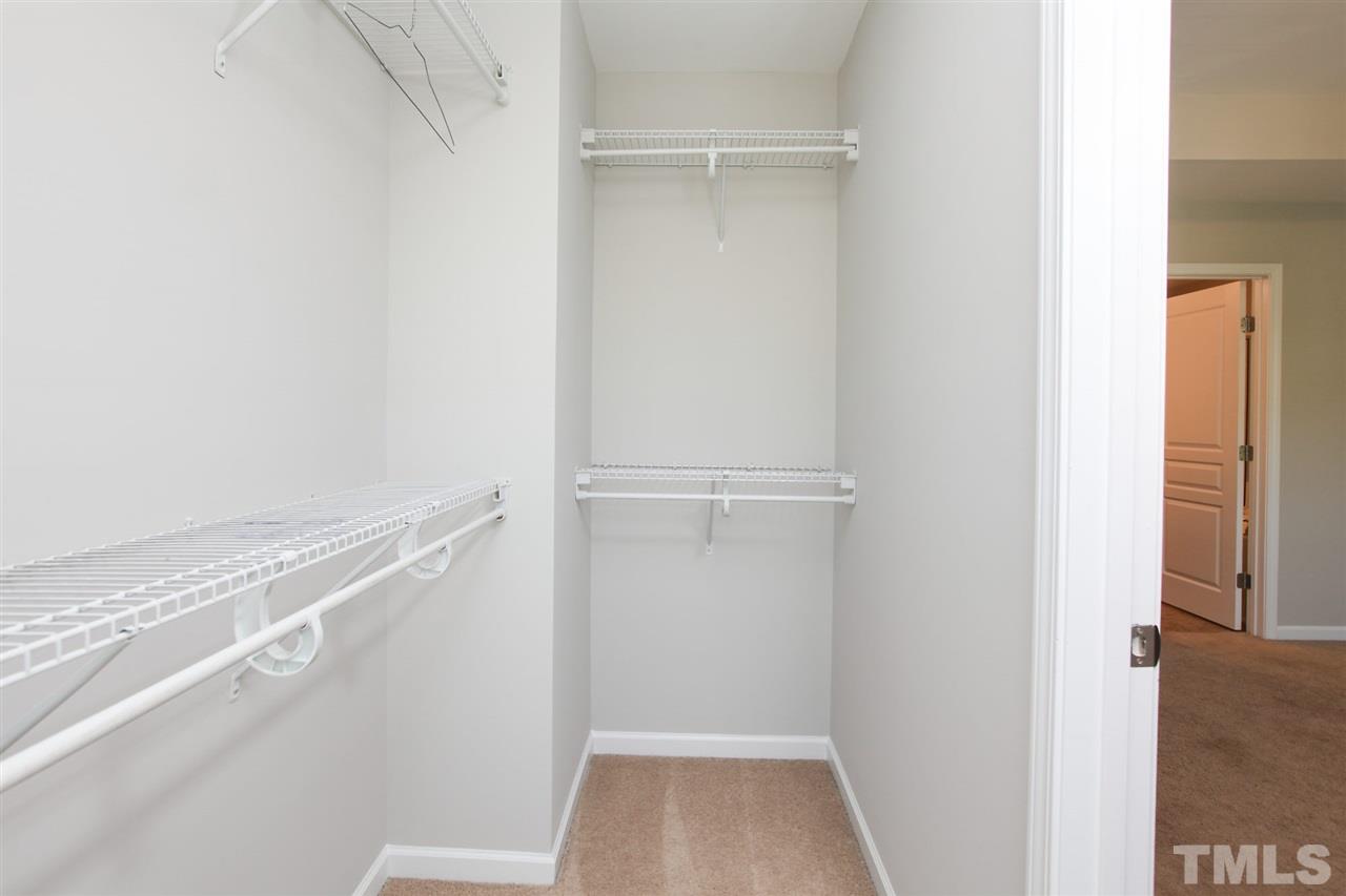 1025 Ileagnes Road Raleigh, NC 27603 - Photo 22 of 25 a view of walk in closet with empty racks