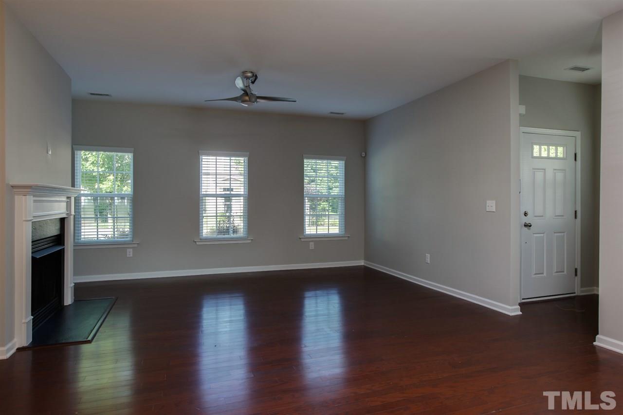 1025 Ileagnes Road Raleigh, NC 27603 - Photo 5 of 25 a view of an empty room with wooden floor and a window