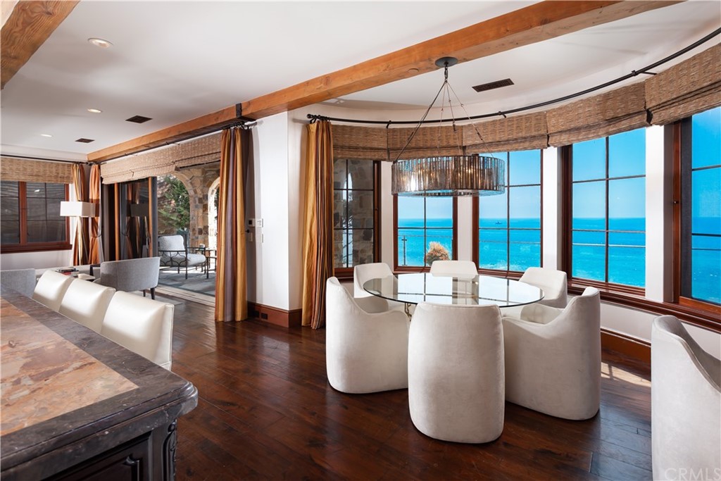 177 Shorecliff Road Corona del Mar, CA 92625 - Photo 13 of 48 a living room with couches a coffee table and a large window with wooden floor