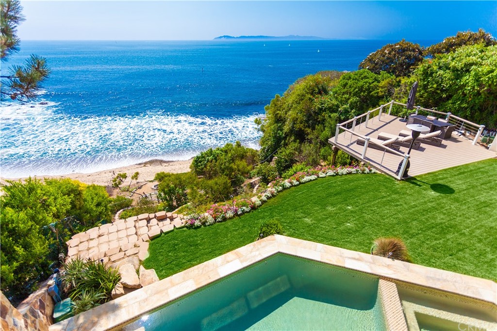 177 Shorecliff Road Corona del Mar, CA 92625 - Photo 16 of 48 a view of a yard with an ocean beach