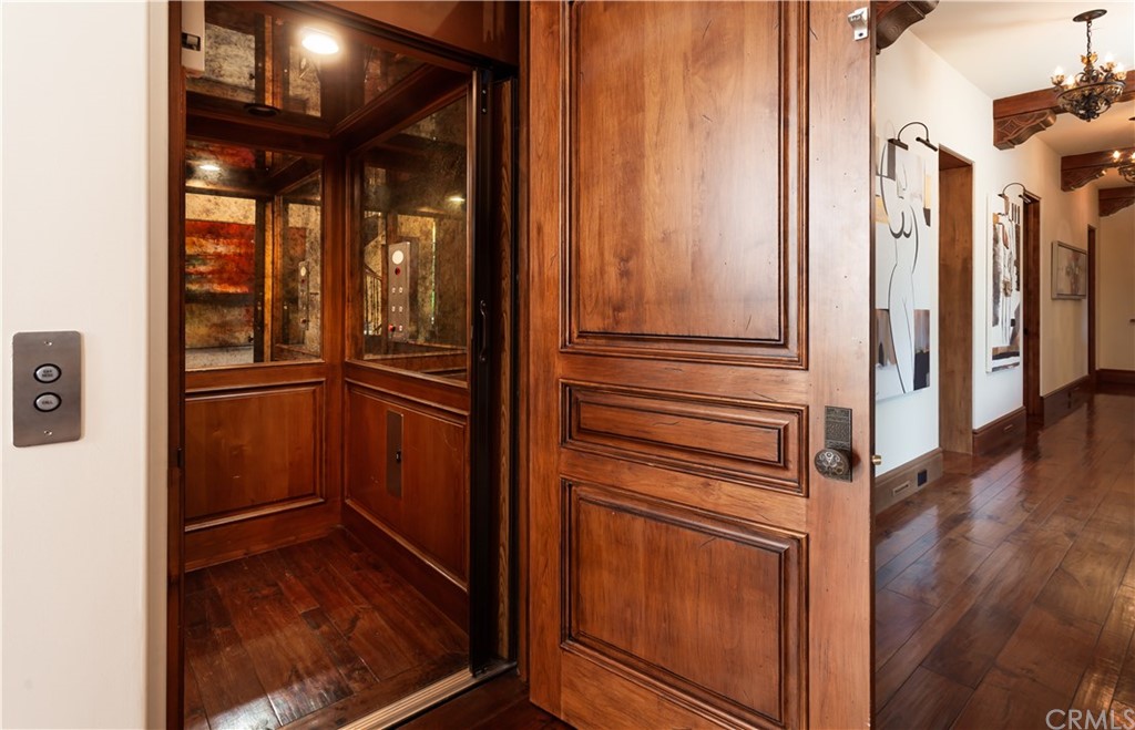 177 Shorecliff Road Corona del Mar, CA 92625 - Photo 21 of 48 a view of walk in closet with wooden floor