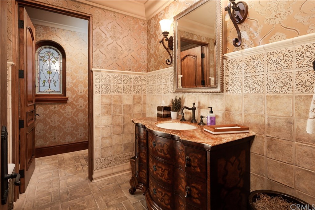 177 Shorecliff Road Corona del Mar, CA 92625 - Photo 22 of 48 a bathroom with a sink a mirror and a shower