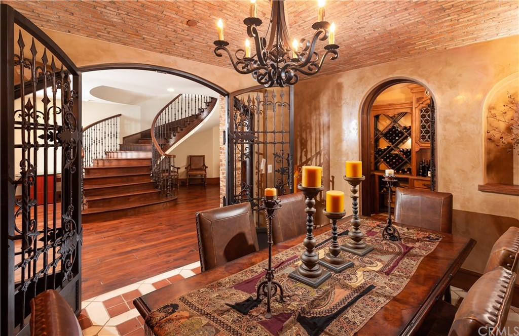 177 Shorecliff Road Corona del Mar, CA 92625 - Photo 27 of 48 a living room with couches a dining table with chandelier
