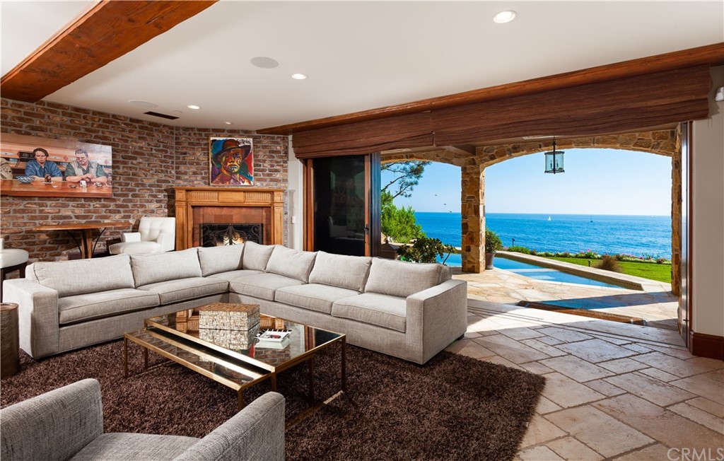 177 Shorecliff Road Corona del Mar, CA 92625 - Photo 32 of 48 a living room with furniture fireplace and a large window