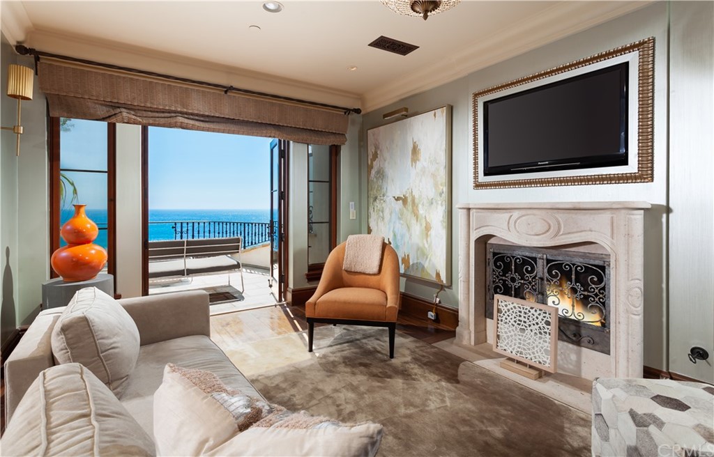 177 Shorecliff Road Corona del Mar, CA 92625 - Photo 40 of 48 a living room with furniture and a fireplace