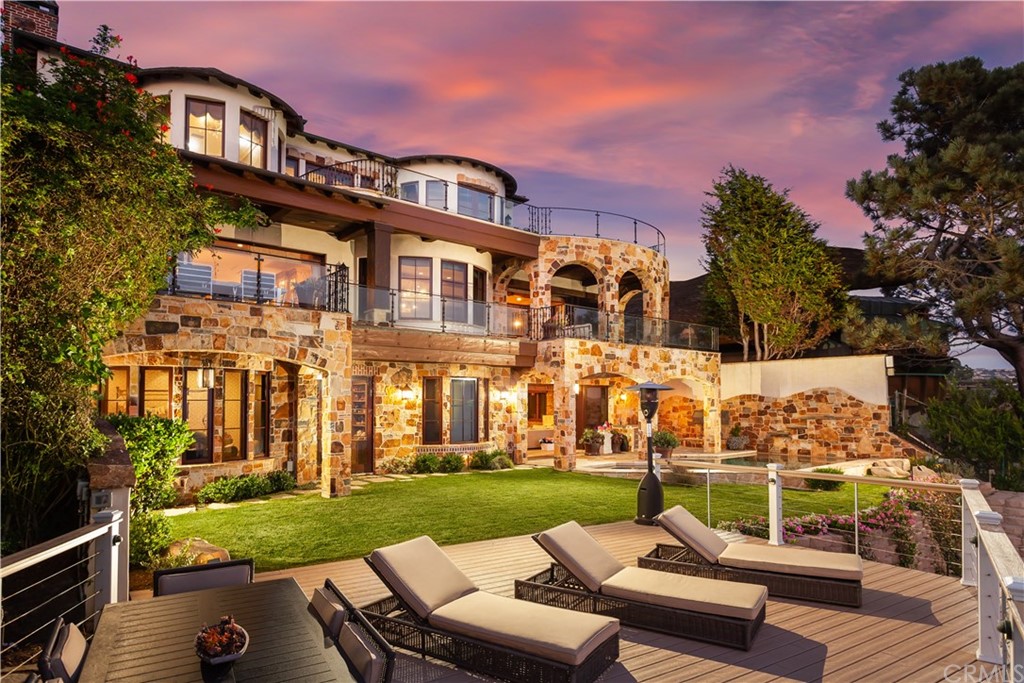 177 Shorecliff Road Corona del Mar, CA 92625 - Photo 4 of 48 front view of a house with a yard table and chairs