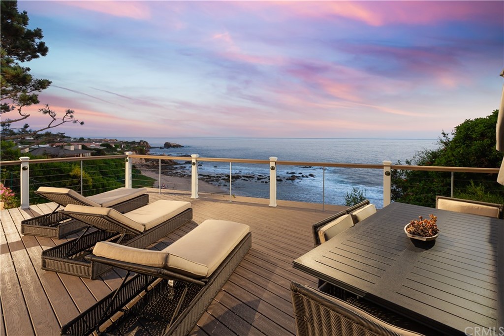 177 Shorecliff Road Corona del Mar, CA 92625 - Photo 47 of 48 a view of a balcony with wooden floor and outdoor seating