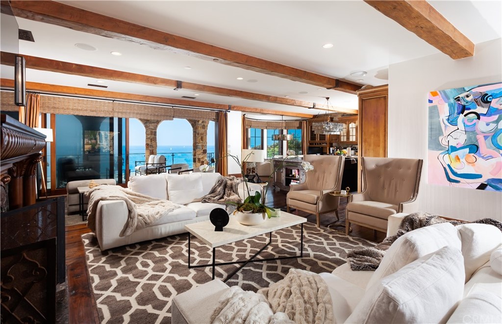 177 Shorecliff Road Corona del Mar, CA 92625 - Photo 10 of 48 a large living room with a couch and a floor to ceiling window