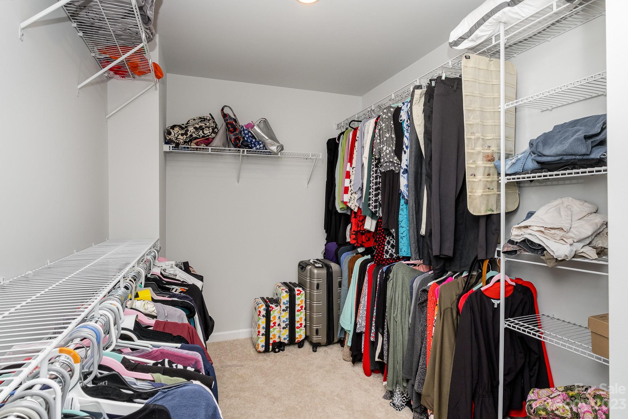 7015 Messina Road Indian Land, SC 29707 - Photo 32 of 42 a view of walk in closet with clothes and shoes