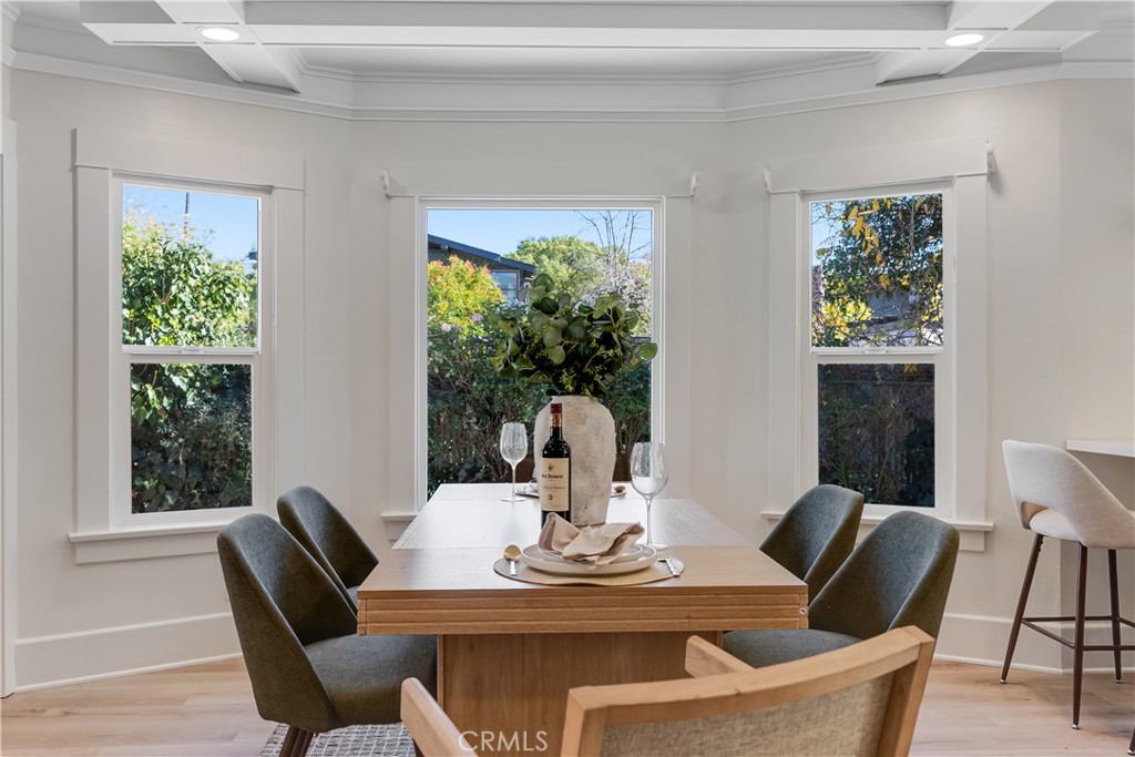 400 Flower Street Pasadena, CA 91104 - Photo 11 of 37 a view of a dining room with furniture window and wooden floor