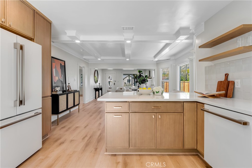 400 Flower Street Pasadena, CA 91104 - Photo 15 of 37 a spacious kitchen with stainless steel appliances granite countertop a sink and cabinets
