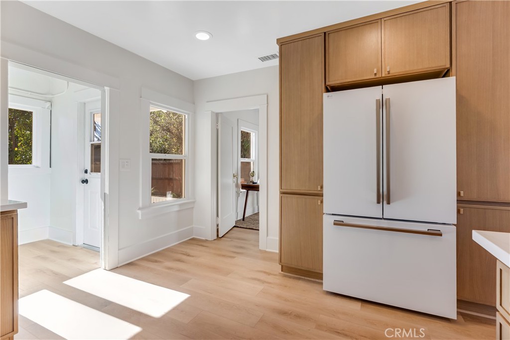 400 Flower Street Pasadena, CA 91104 - Photo 16 of 37 a view of a refrigerator in kitchen and an empty room
