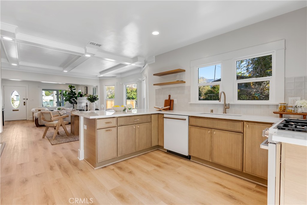400 Flower Street Pasadena, CA 91104 - Photo 17 of 37 a kitchen with sink cabinets and dining table view
