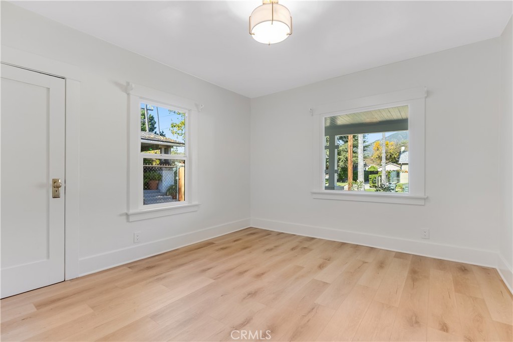 400 Flower Street Pasadena, CA 91104 - Photo 19 of 37 a view of an empty room with a window and wooden floor