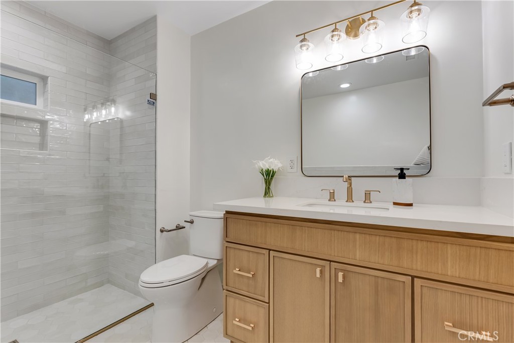 400 Flower Street Pasadena, CA 91104 - Photo 22 of 37 a bathroom with a sink a toilet and shower