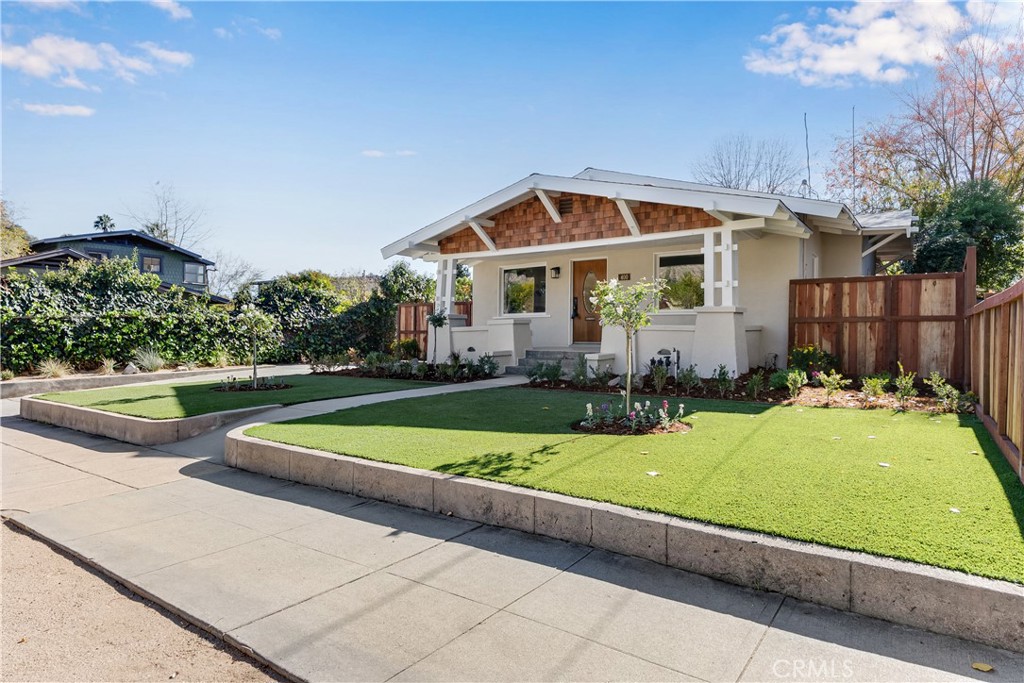 400 Flower Street Pasadena, CA 91104 - Photo 3 of 37 a view of a house with swimming pool and yard