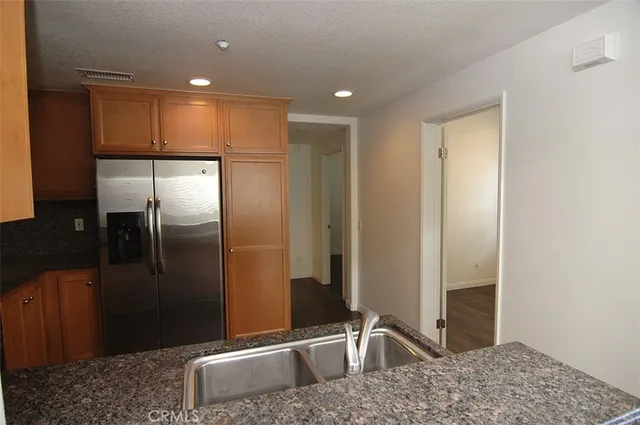 a bathroom with a sink a large mirror and a shower