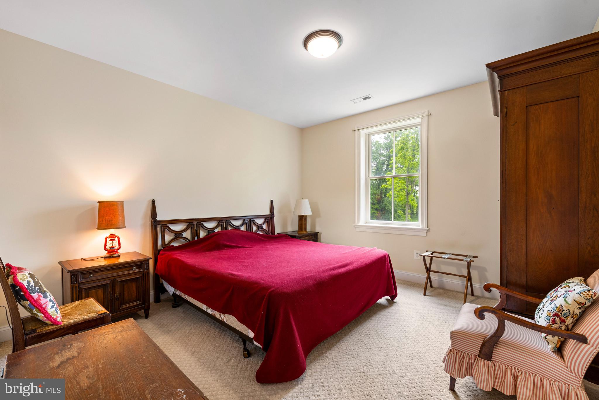 20147 Woodtrail Road Round Hill, VA 20141 - Photo 32 of 41 a bedroom with a bed and a window
