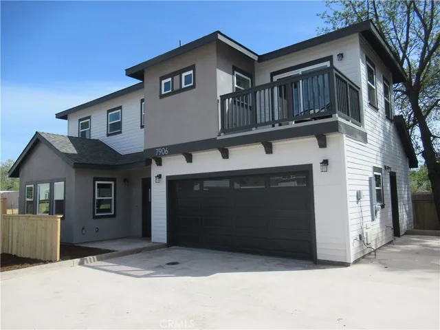 a front view of a house with a garage