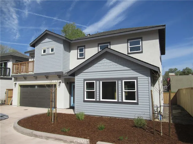 a front view of a house with garage