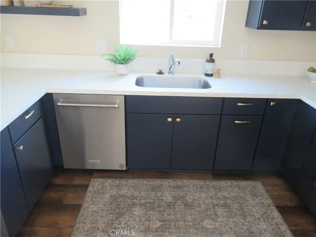 a kitchen with a sink and a microwave